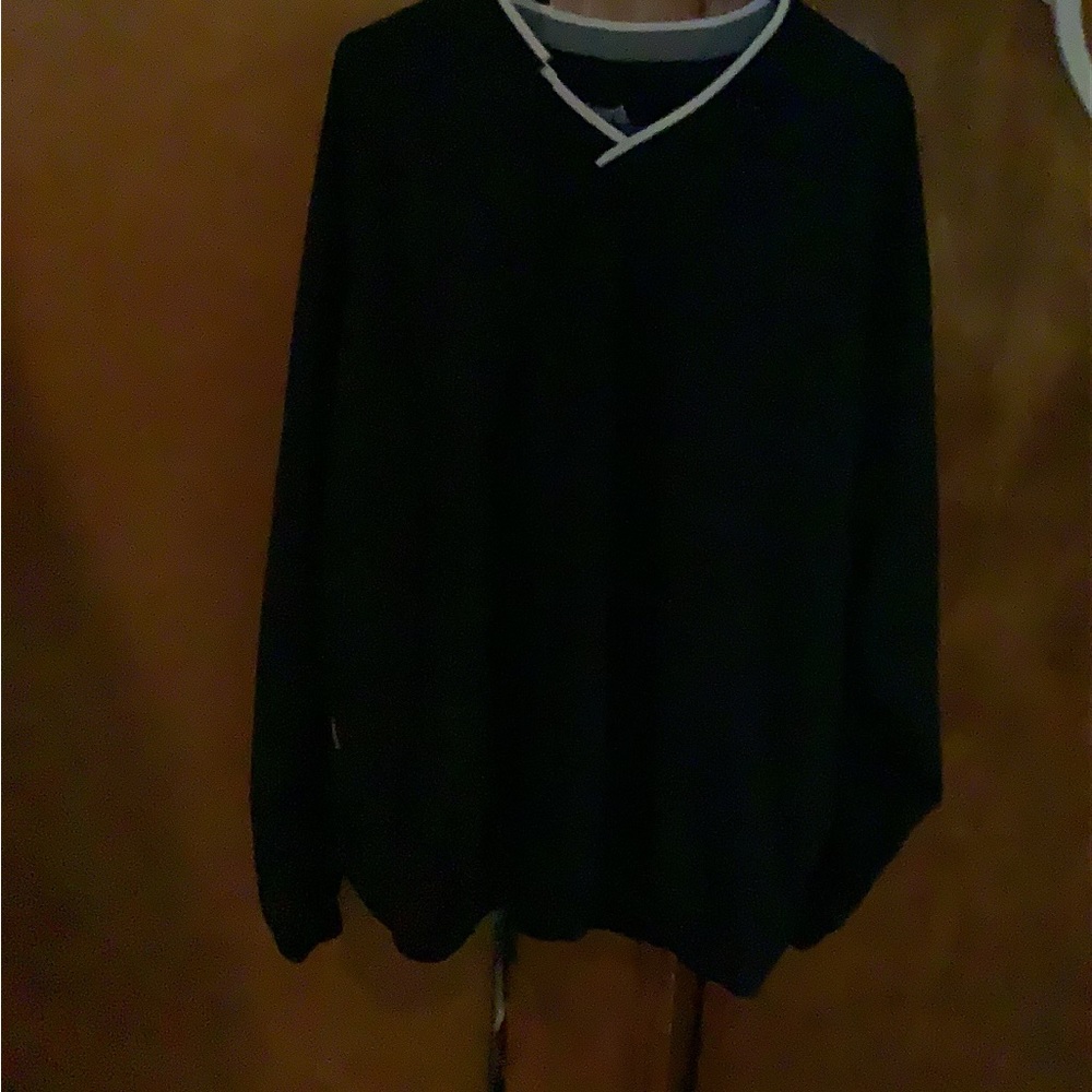 A man’s thin, windbreaker pull over